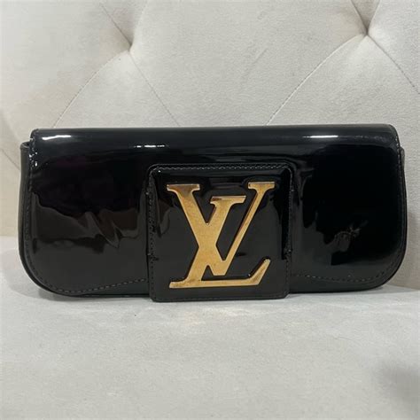 Sobe patent leather clutch bag Louis Vuitton Black in Patent 